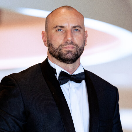Stirling Cooper wearing a black tuxedo in a professional portrait